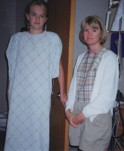 Lindsay in a hospital gown standing next to her mother