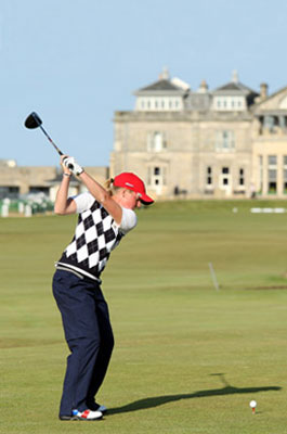 Female golfer in the middle of a tee shot with a driver